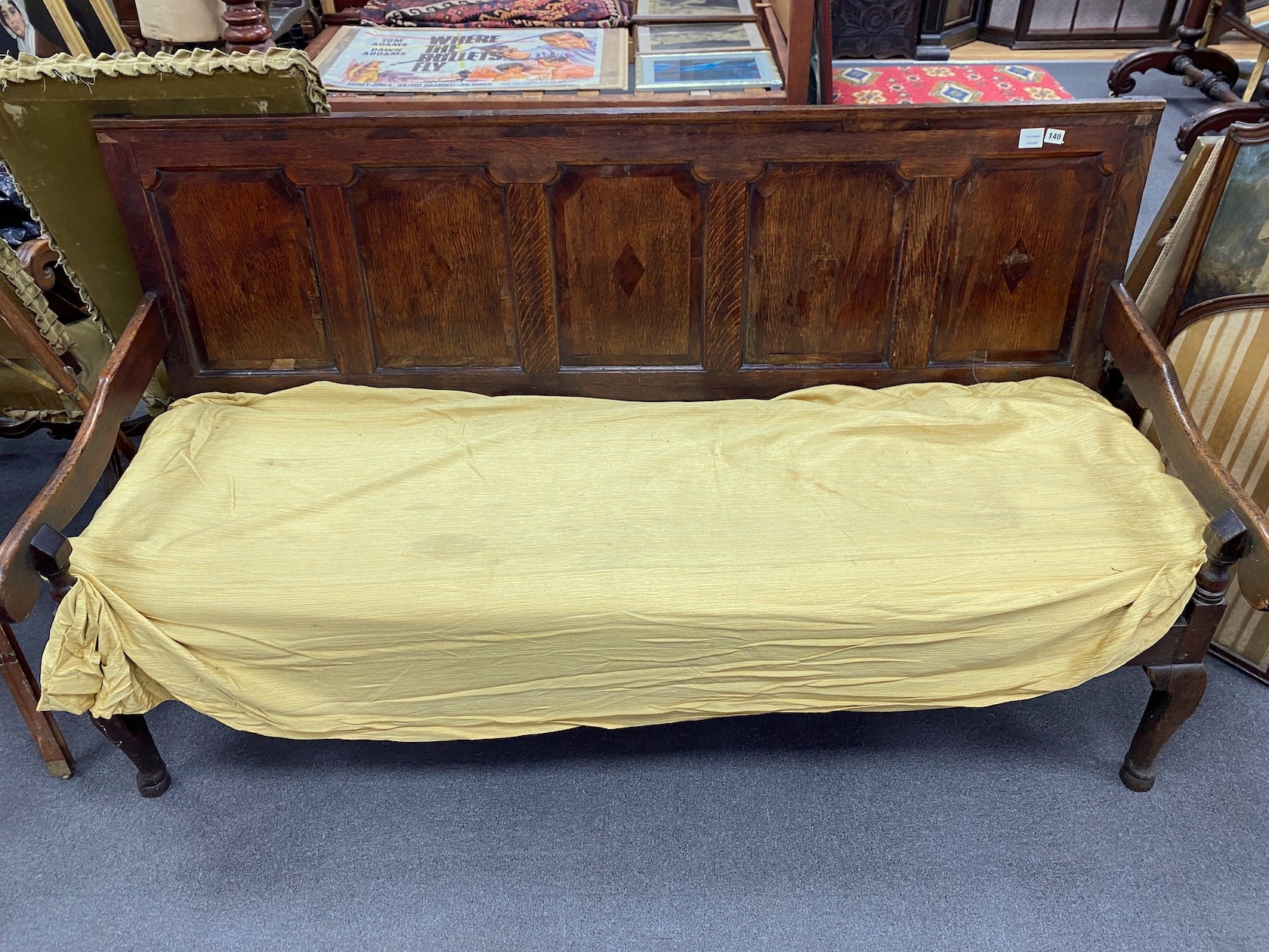A George III banded oak settle, length 186cm, depth 74cm, height 104cm